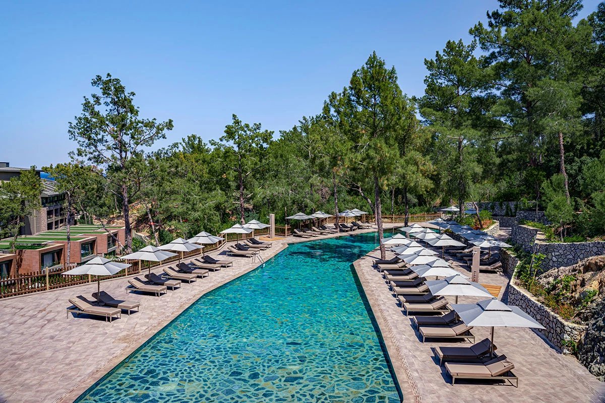 NG Phaselis Bay — adult pool with sun loungers