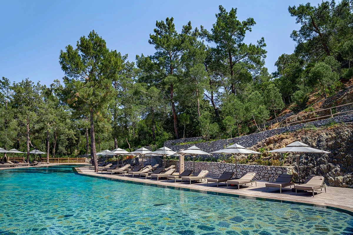 NG Phaselis Bay — adult pool along the forest terrace