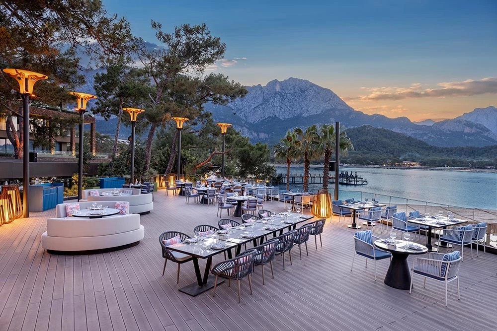 NG Phaselis Bay — Scallops restaurant terrace at sunset