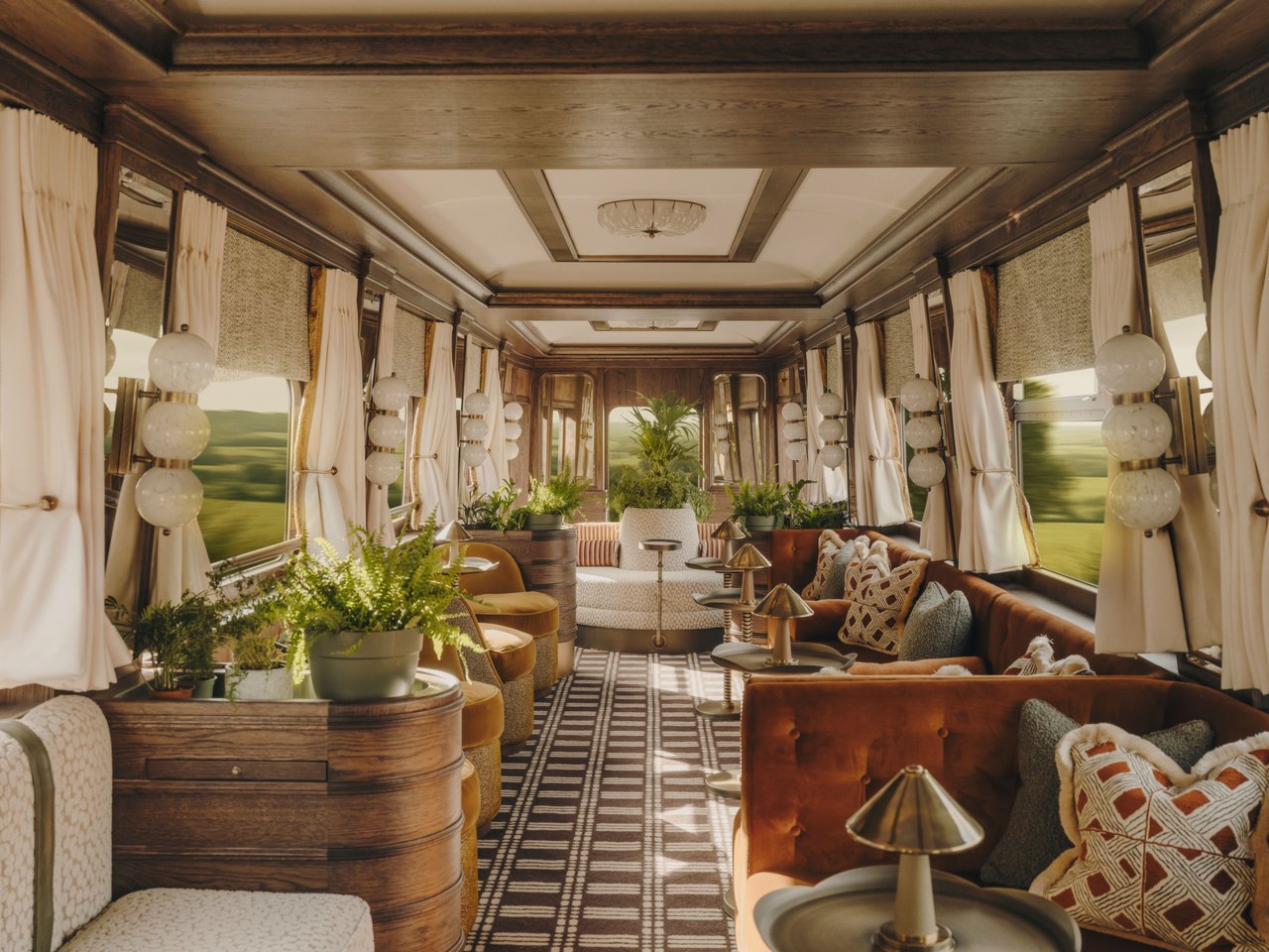 The plant-filled lounge car of a Belmond train