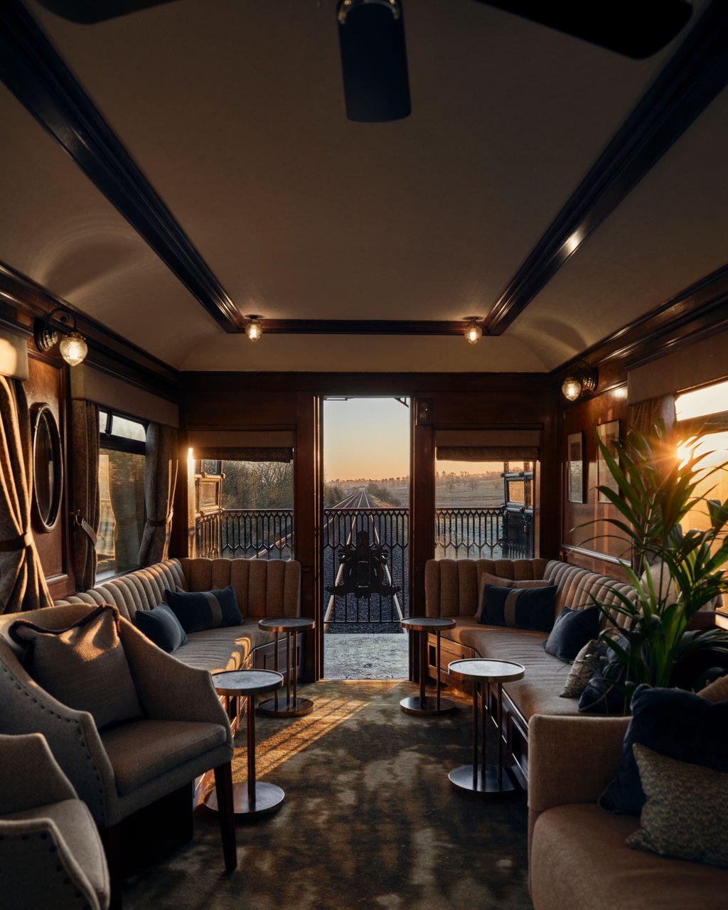 The observation lounge car of a Belmond train at sunset
