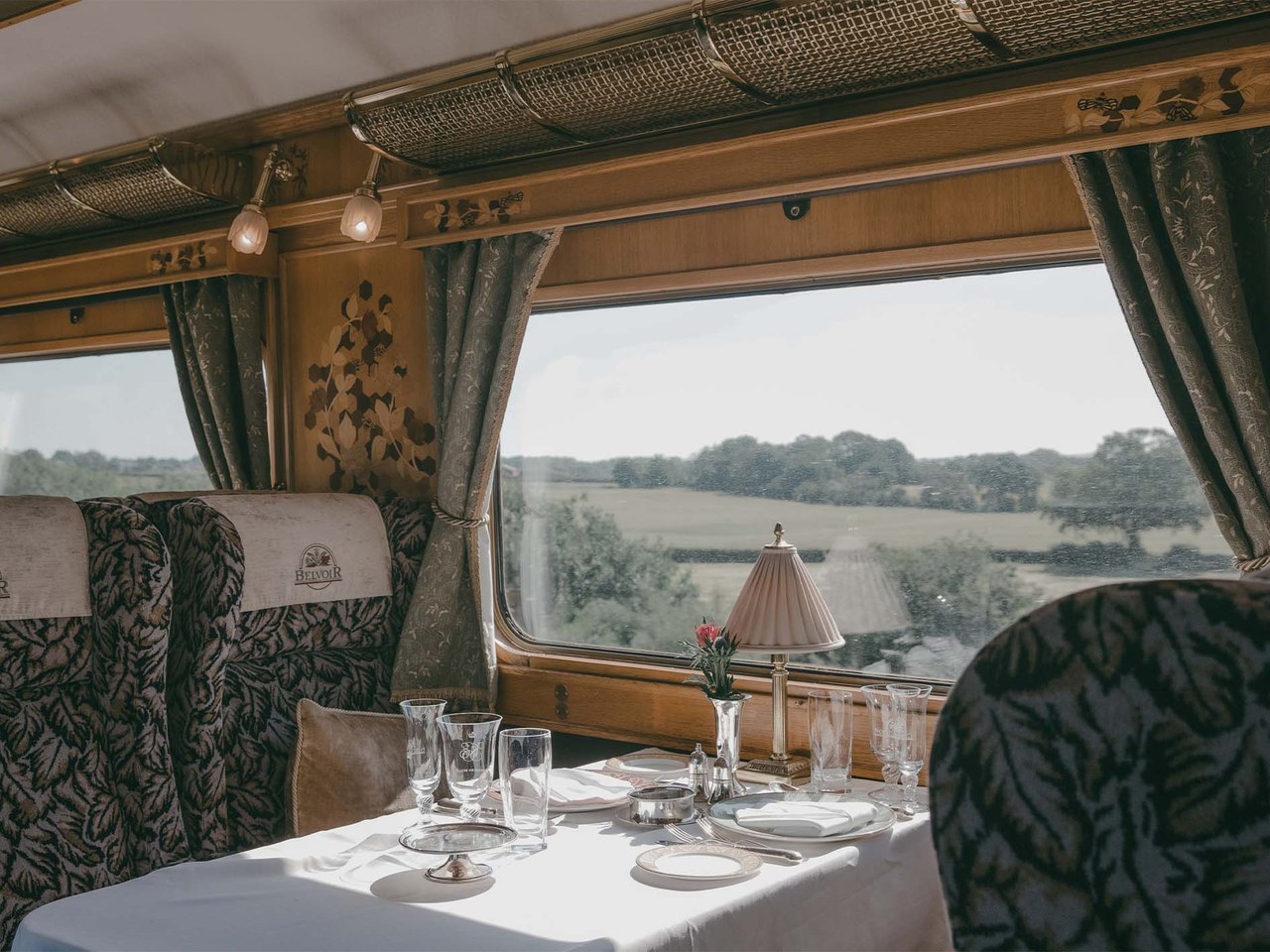 A Northern Belle dining table laid beside the carriage window