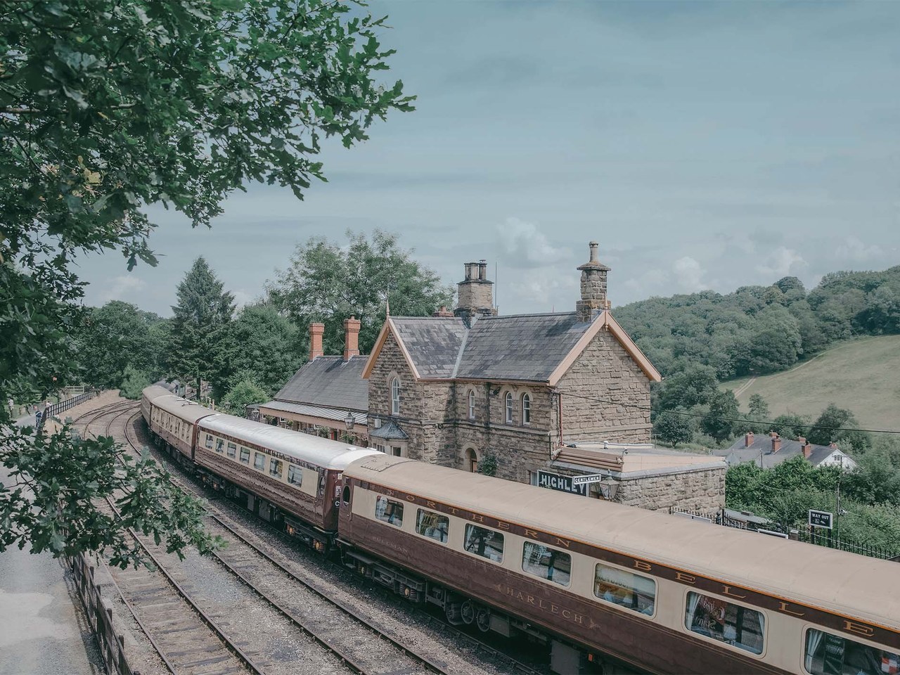 The Northern Belle arriving at a period English railway station