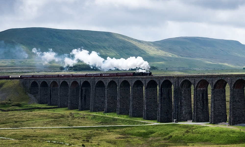 A steam locomotive hauling the Northern Belle across the Ribblehead Viaduct